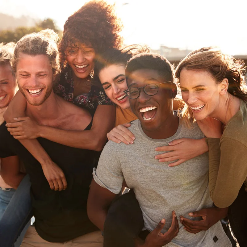 a diverse group of friends poses for a photograph