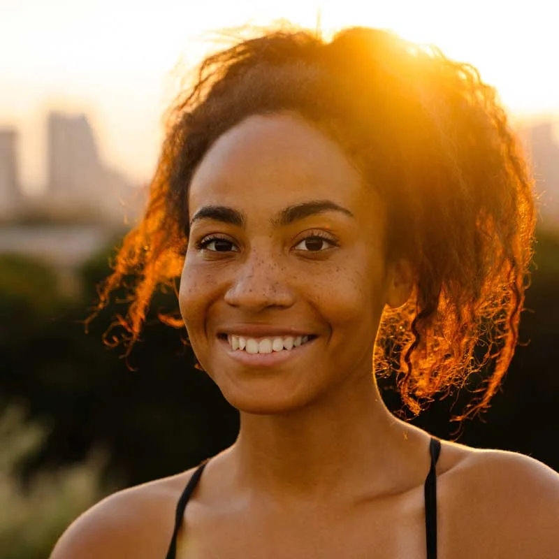 a young woman smiles at the camera