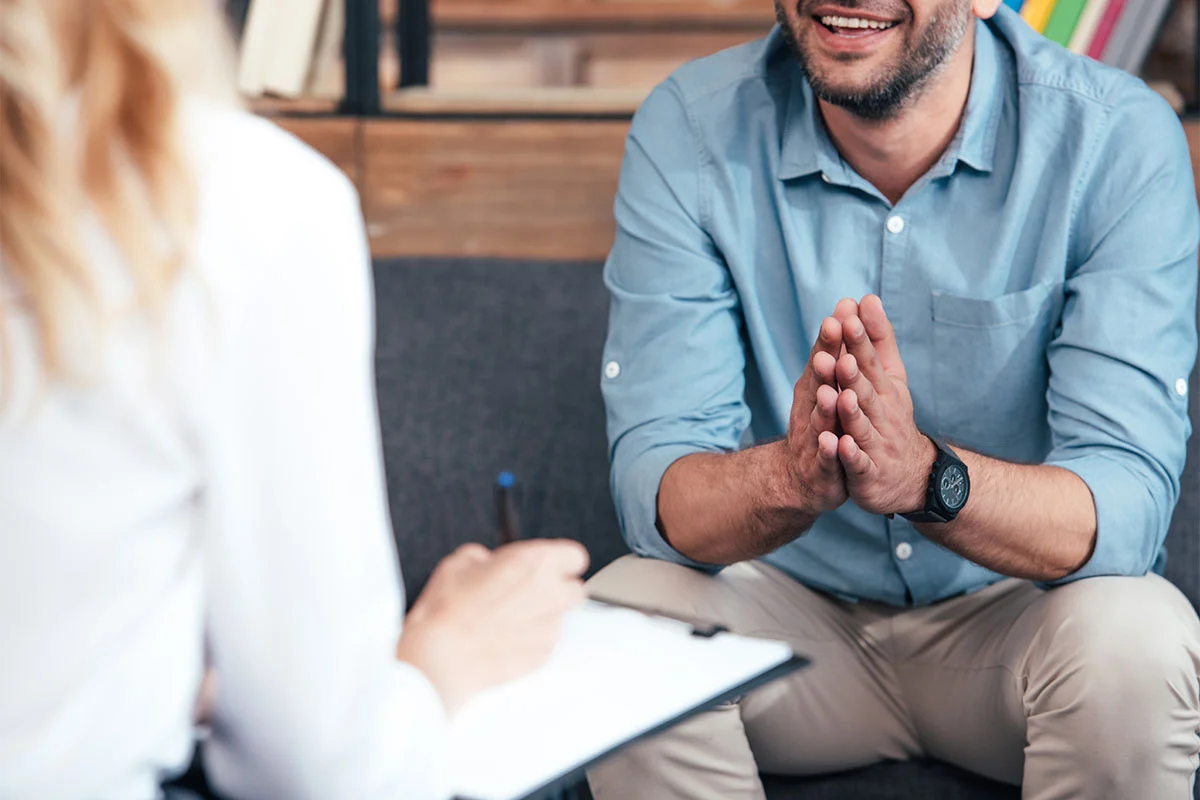 Man talking to therapist