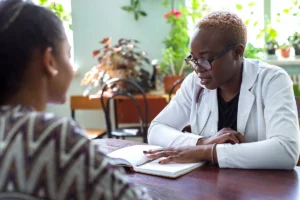 Doctor in office with plants explaining Suboxone and Subutex